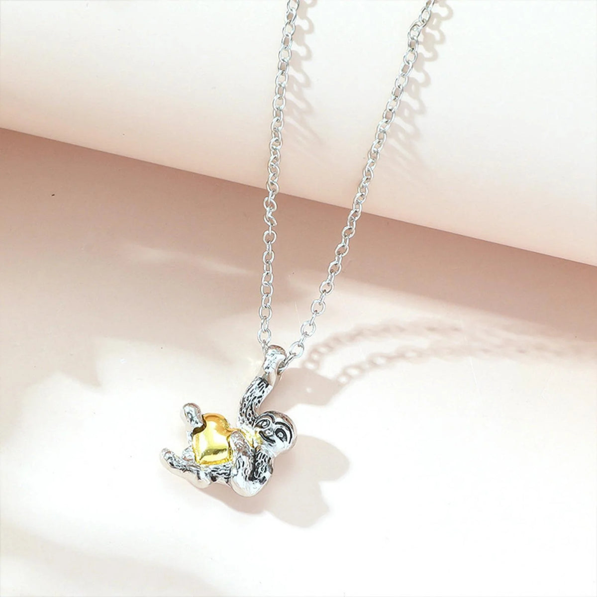 Sterling Silver Sloth Holding A Heart Necklace