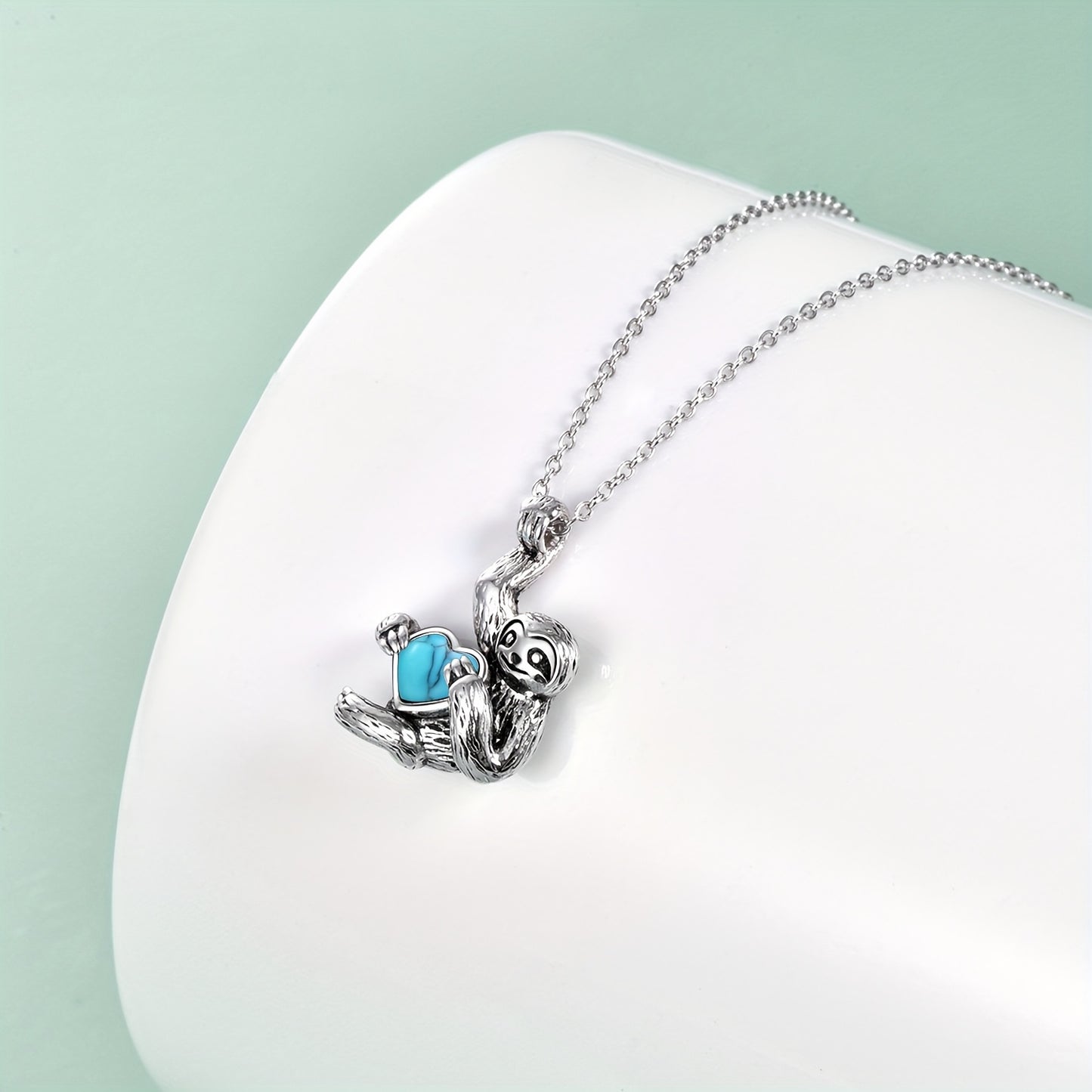 Sterling Silver Sloth Necklace Holding Turquoise Heart