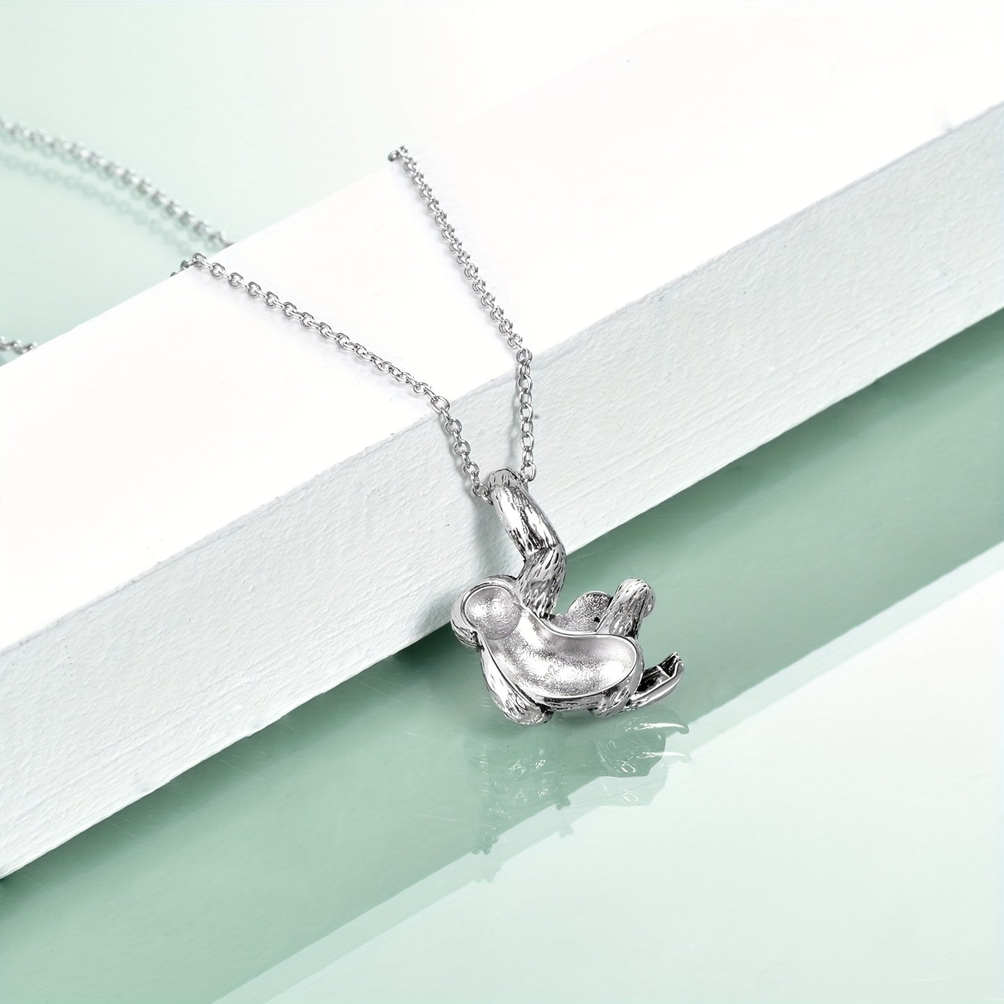 Sterling Silver Sloth Necklace Holding Turquoise Heart